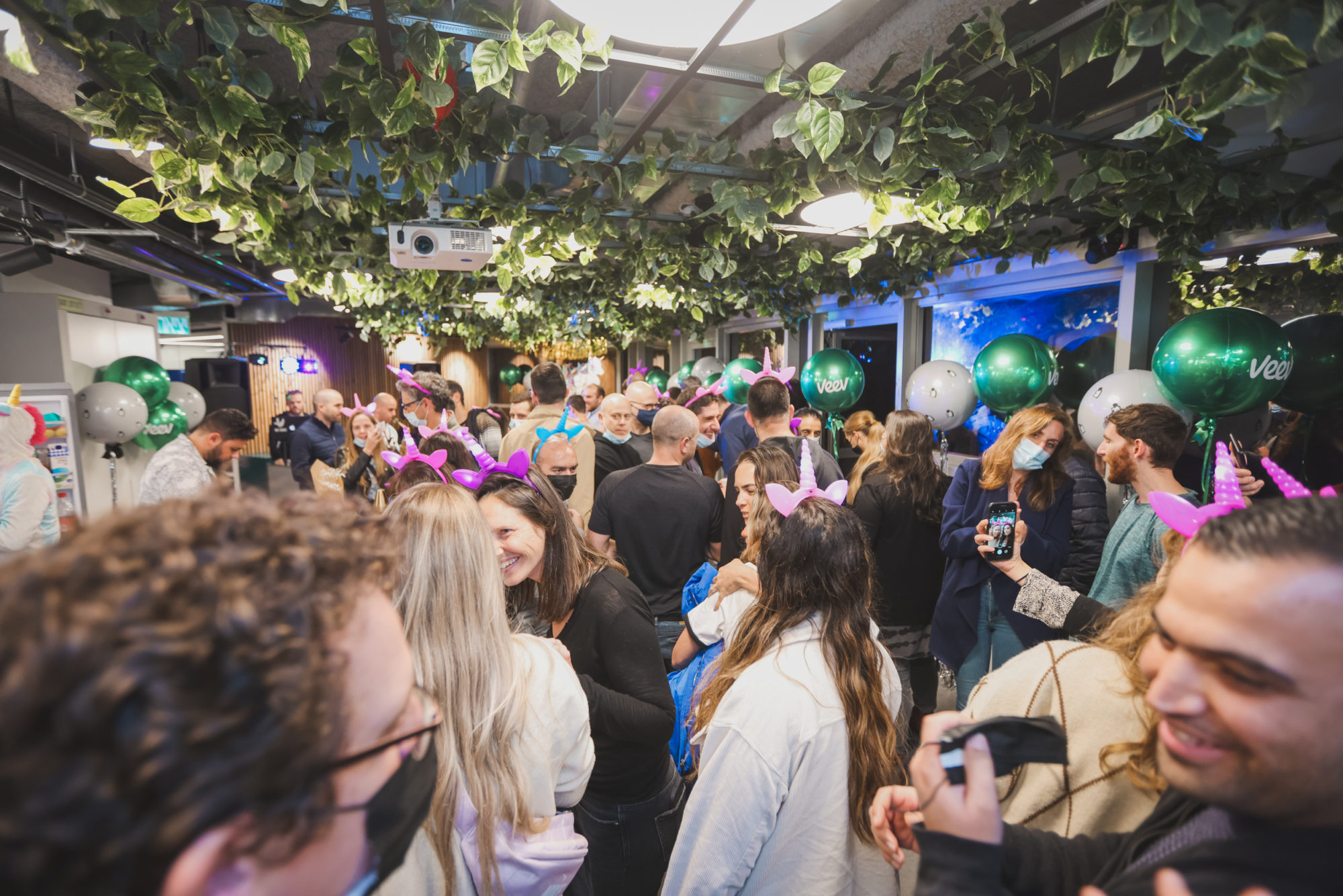 A crowd of people in the Veev office